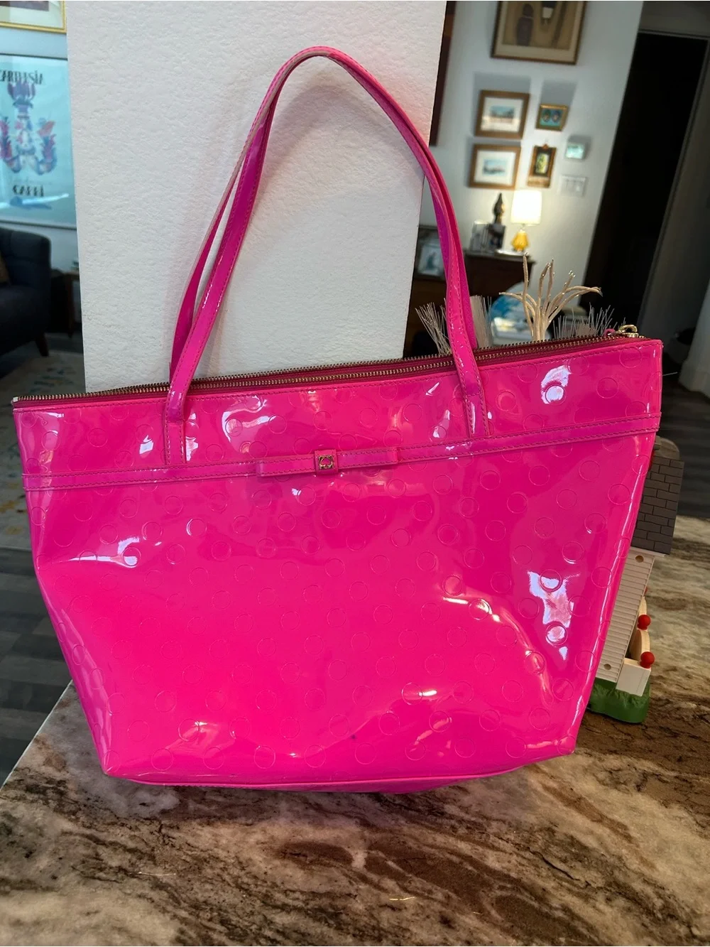 kate spade camellia st Sophie Tote in Hot Pink has a few marks scuffs peeling